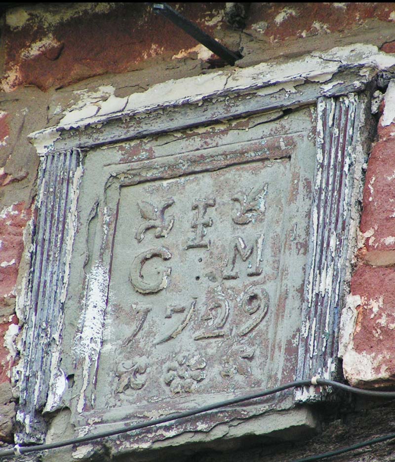 A photo showing the Rising Sun date stone.